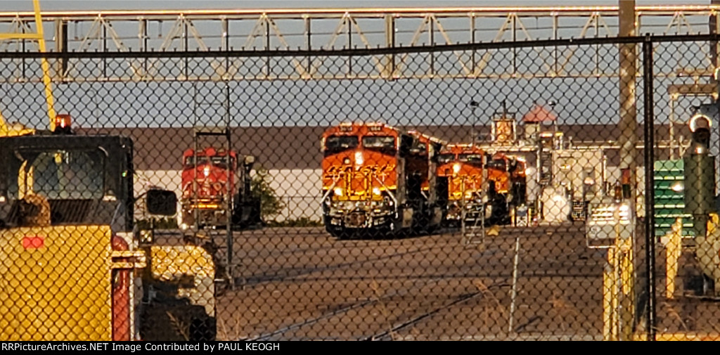 The BNSF Swoosh Logo Paint Jobs Stand Out As The Setting Texas Sun Reflects Off The Locomotives. 